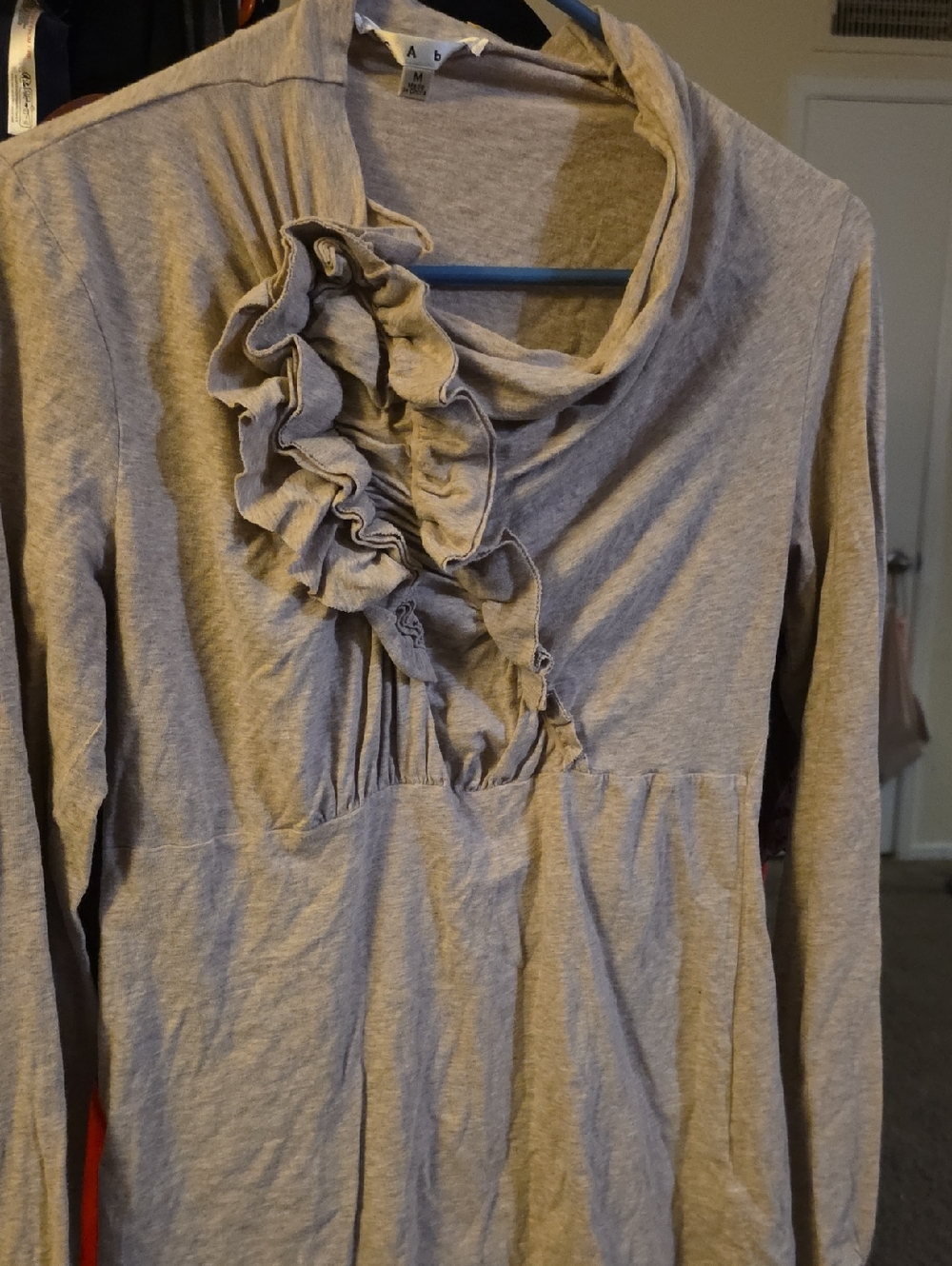 CAbi Ruffle-Front Long Sleeve Tunic in Gray Ish Tan. Med